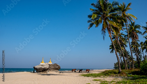 Buddhist stupas at Ngwe Saung Beach on the Bay of Bengal in western Myanmar photo