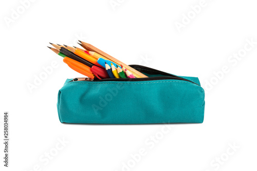Fotografia Colorful pencil and pens in a case isolated on white