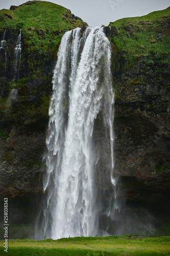 famous Seljalandsfoss waterfall in southern Iceland. treking in Iceland. Travel and landscape photography concept
