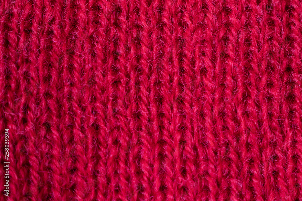 Knitted texture close-up, visible threads and fibers. The image is suitable as a background for various tasks.