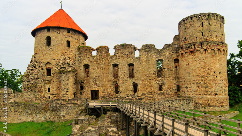 View of ruins of ancient Livonian castle in old town of Cesis, Latvia at sunny day, selective focus