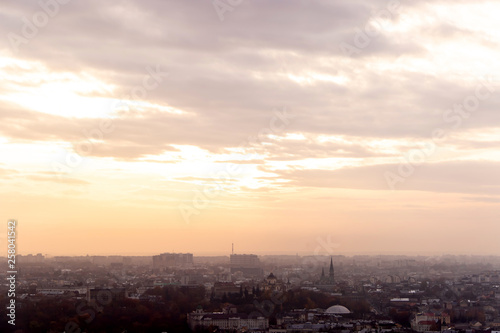 sunset over a big city from a high mountain