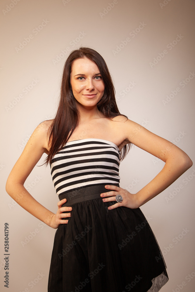 Beautiful brunette girl posing for photo at the studio Beautiful brunette girl posing for photo at the studio