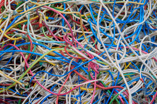 Wallpaper Mural Flexible electrical wire is very much confusing. Cables of different colors. Confusion, chaos, disorder. A tangle of twisted wires. Lots of tangled cables. Background or backdrop. Torontodigital.ca