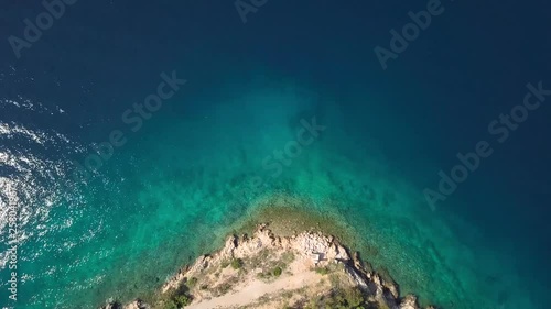 Aerial view of crystal clear water off the coastline inisland Krk, Croatia photo