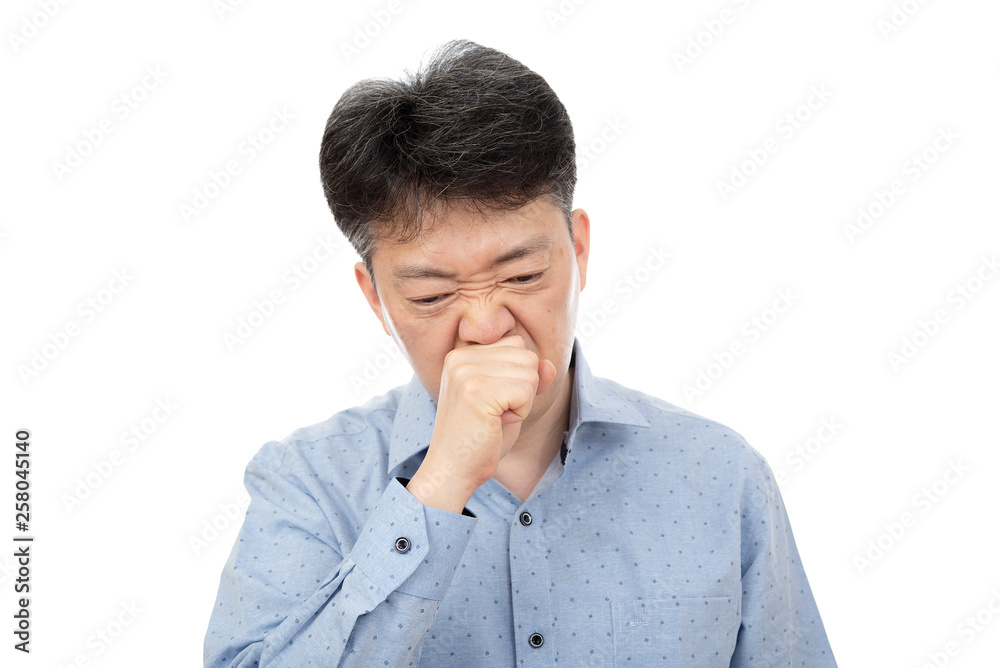 A middle-aged man suffering from rhinitis on white background. A middle-aged man suffering from rhinitis on white background.