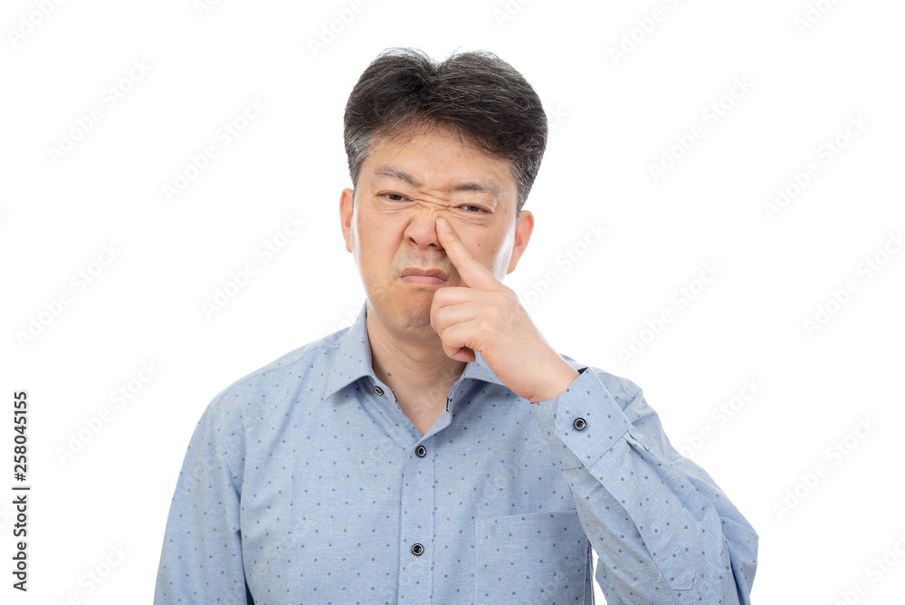 A middle-aged man suffering from rhinitis on white background.