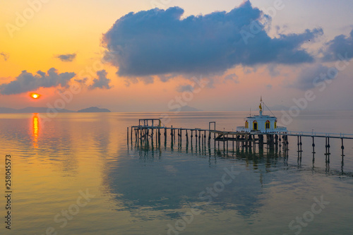 aerial view sunrise at pier of Phayam temple one landmark of Phayam island. Phayam temple is on Hin Kao gulf. .The temple is close to the shipping port. in the end of Phayam temple pier have memorial