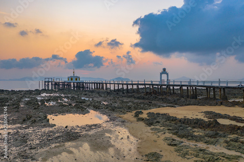 aerial view sunrise at pier of Phayam temple one landmark of Phayam island. Phayam temple is on Hin Kao gulf. .The temple is close to the shipping port. in the end of Phayam temple pier have memorial