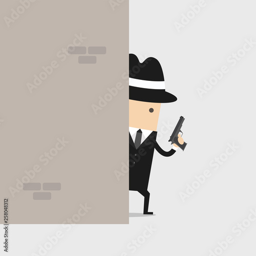 Detective holding a gun behind the wall.
