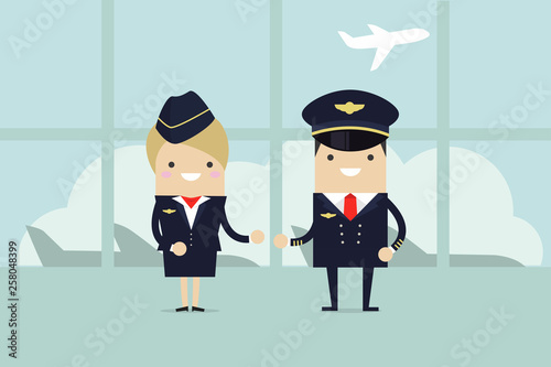 Professional aviation crew members. Crew of civil airplane in the airport building. Pilots and stewardesses welcome.