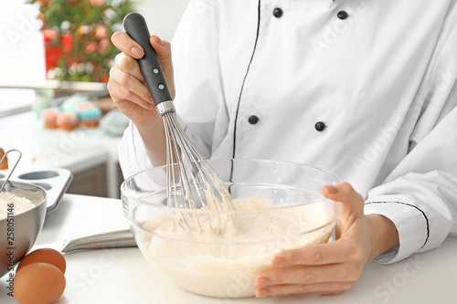 Professional chef whisking ...