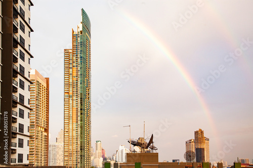 skyscrapers and BTS in Bangkok against rainbow sky © Melinda Nagy
