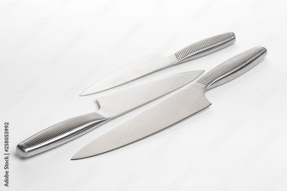 Set of steel kitchen knives on white background Set of steel kitchen knives on white background