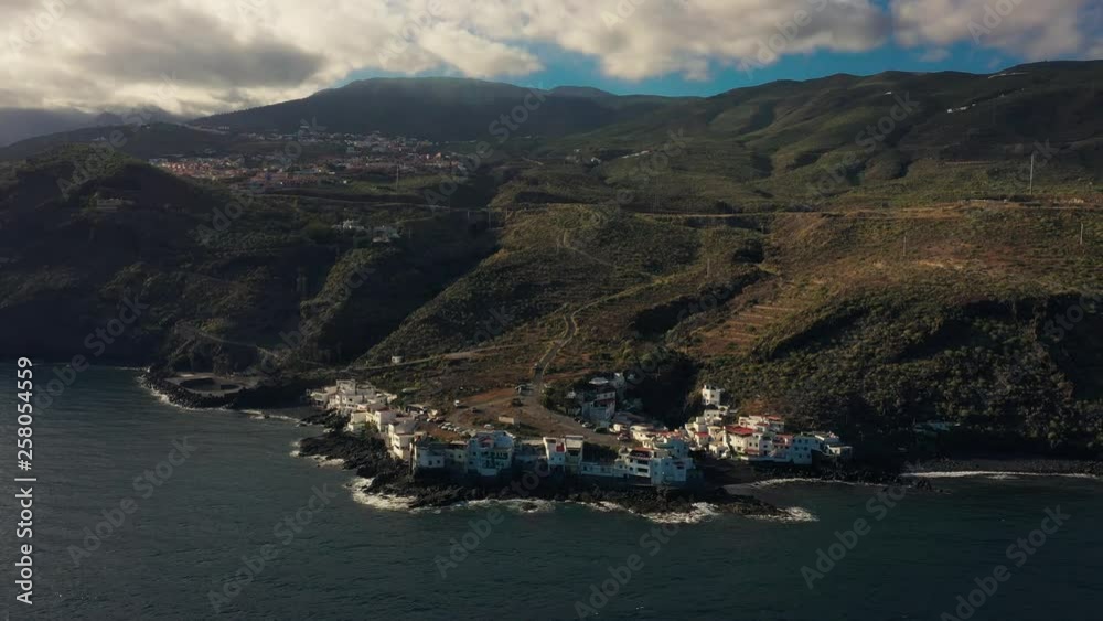 Departing from beautiful white houses along the coast of Tenerife. Departing from beautiful white houses along the coast of Tenerife.