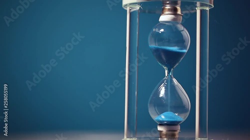 Hourglass on blue background