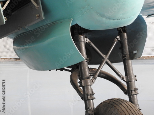 Old aircraft near, skin, parts and engine components.