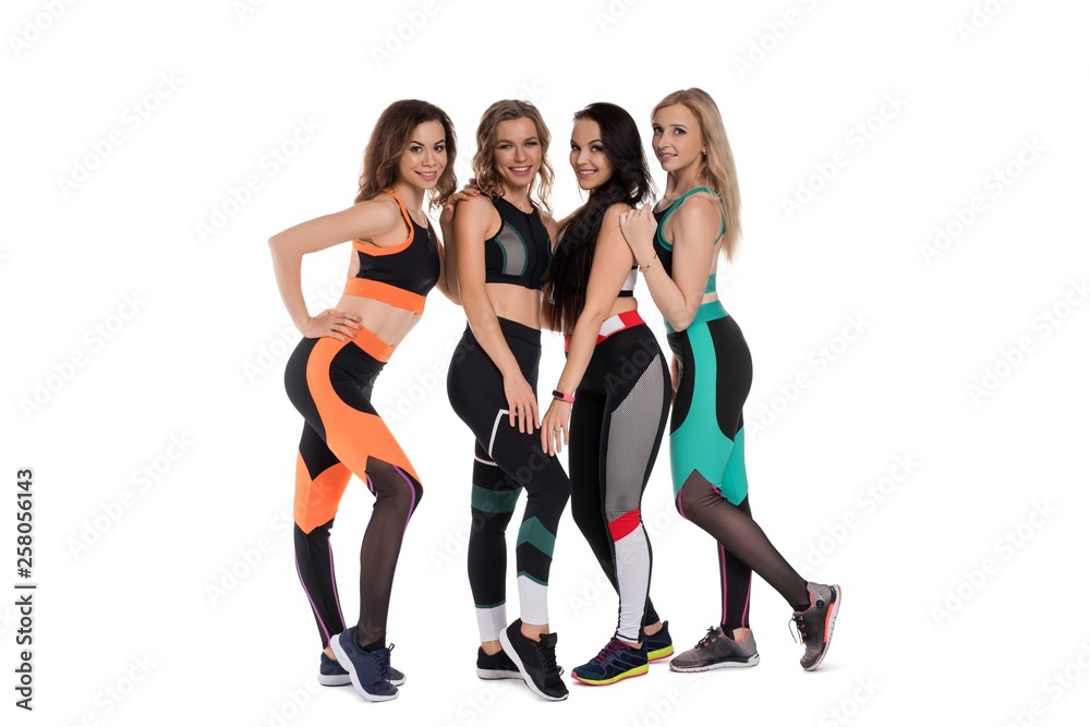 Obraz premium Group of slim happy girls doing fitness shot