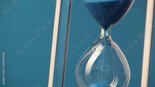 Hourglass on blue background