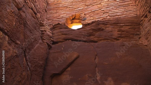 Wallpaper Mural A moving tilt-up shot revealing a stone wall and window of the largest pueblo at Wupatki National Monument in Arizona. Torontodigital.ca