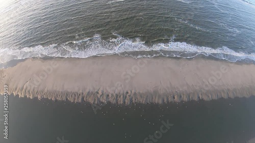 Amazing drone footage above the ocean. Birds in view photo