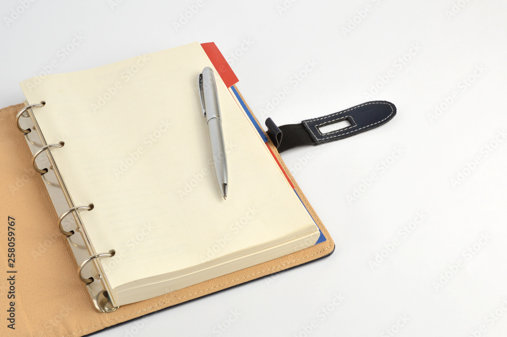 notebook and pen isolated on white background notebook and pen isolated on white background