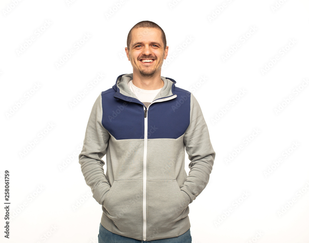 Fototapeta premium Man in hoodie standing at white background