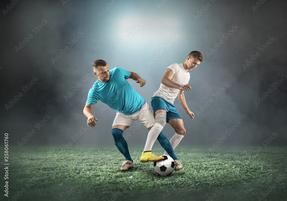 Naklejka premium Soccer player on a football field in dynamic action at summer da