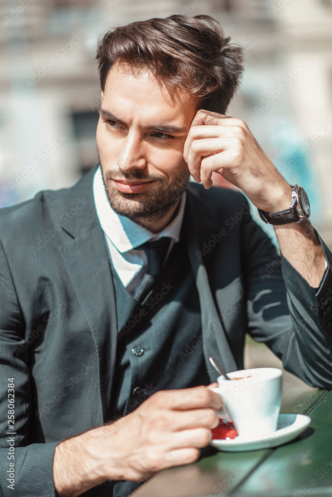 Young handsome business man taking a break from work, enjoying a cup of espresso coffee Young handsome business man taking a break from work, enjoying a cup of espresso coffee