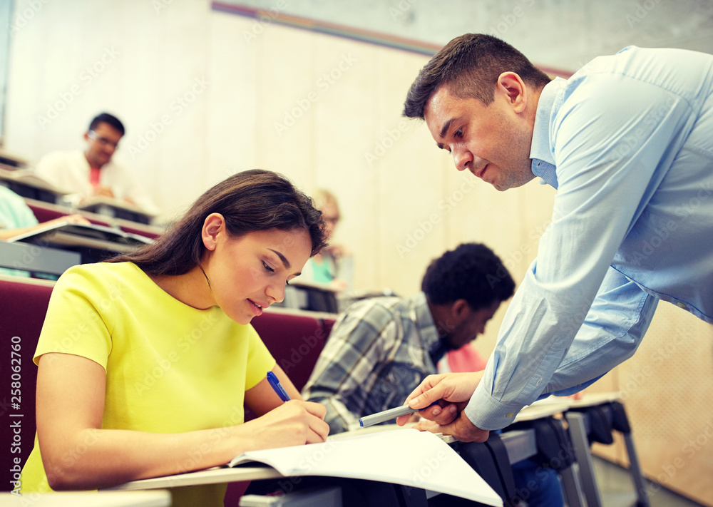 education, high school, teaching, university and people concept - group of international students and teacher at lecture hall education, high school, teaching, university and people concept - group of international students and teacher at lecture hall