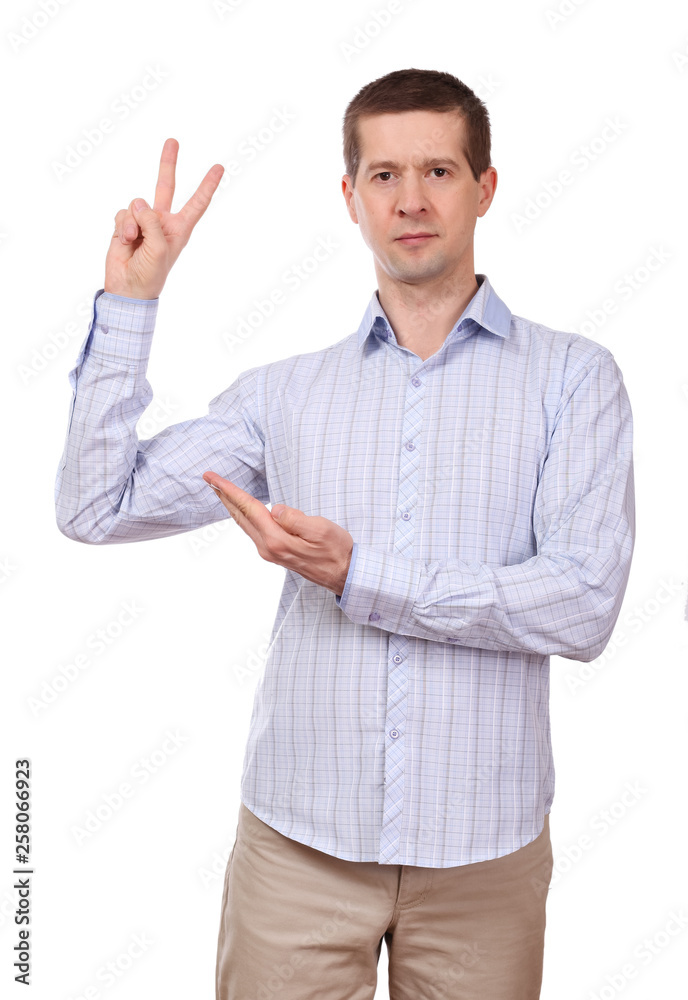The man in a shirt shows gesture a victory The man in a shirt shows gesture a victory