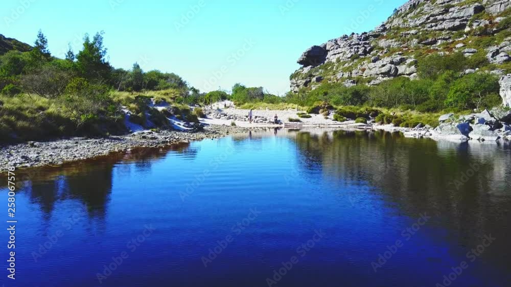 Aerial view over lake in the mountains during summer Aerial view over lake in the mountains during summer