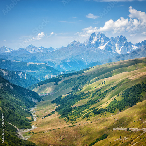 Landscape of caucasian mountains with cloudy sky