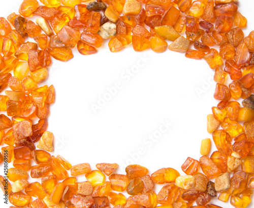 Fotografie, Obraz Frame made with chips of orange Baltic amber isolated on white