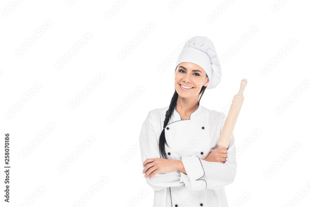 Chef in uniform holding rolling pin isolated on white Chef in uniform holding rolling pin isolated on white