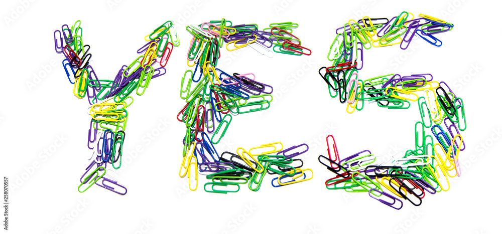Word yes made from color paper clips on a white isolated background