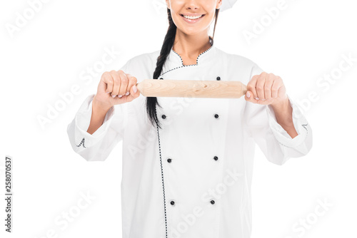 Cropped view of chef in uiform holding rolling pin isolated on white photo