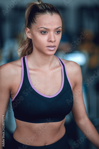 close up.portrait of a confident young woman in the gym.