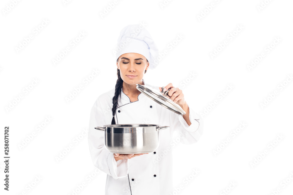 Chef in uniform holding steel pot with closed eyes isolated on white Chef in uniform holding steel pot with closed eyes isolated on white