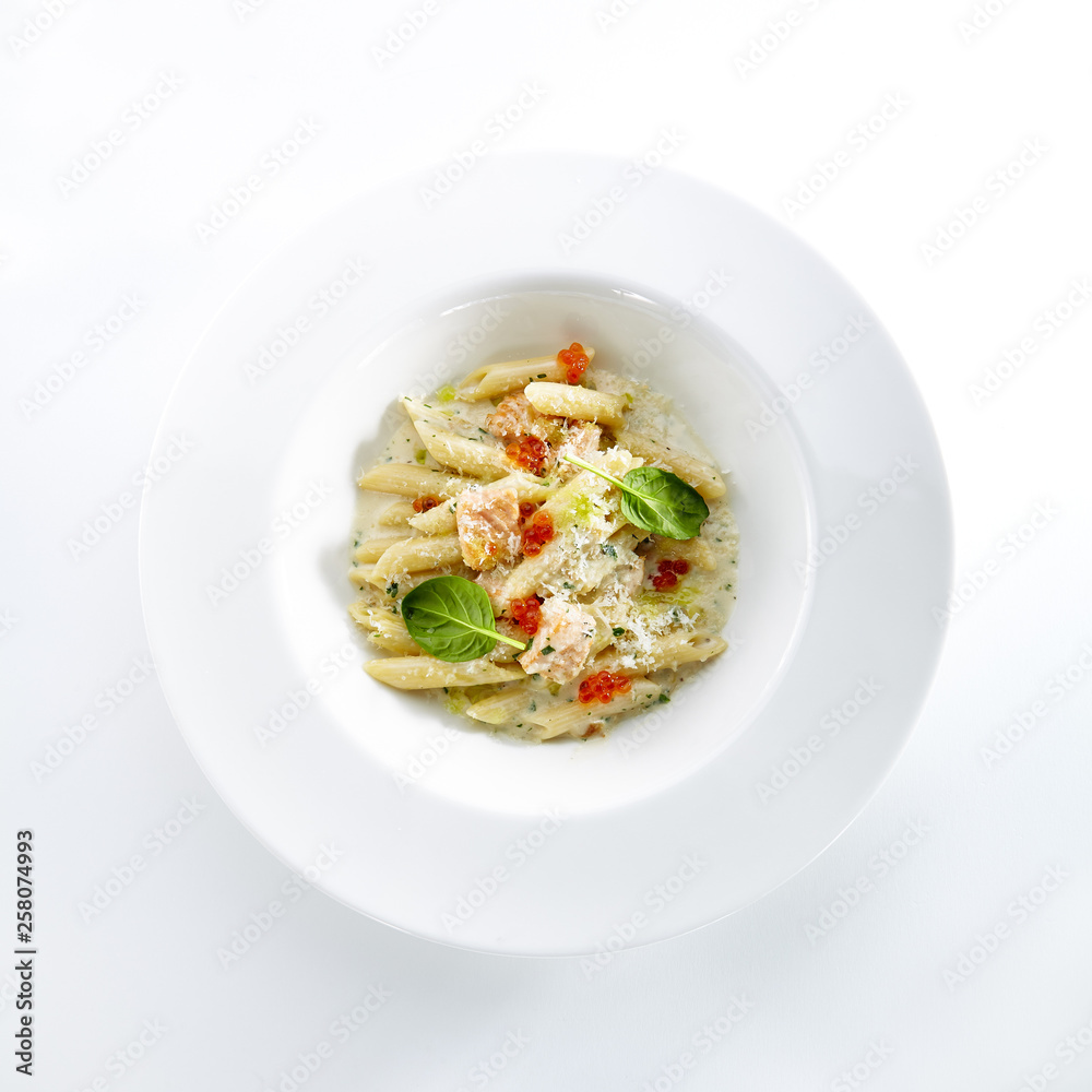 Fish Penne Pasta Al Dente with Salmon Isolated on White Background Fish Penne Pasta Al Dente with Salmon Isolated on White Background