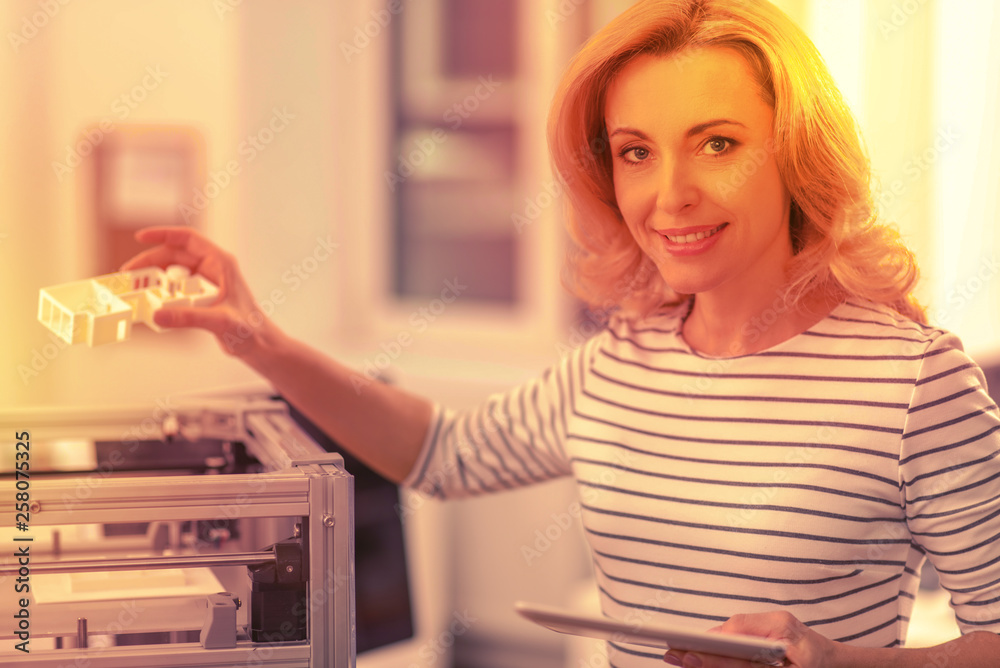 Beautiful hardworking lady smiling gently for the camera. Beautiful hardworking lady smiling gently for the camera.