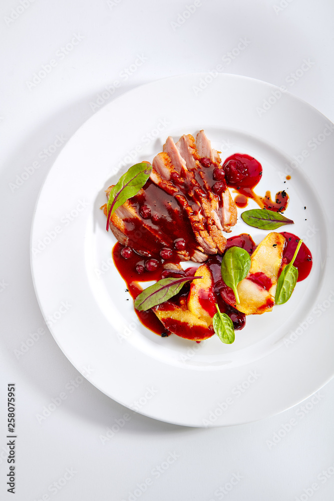 Duck Breast with Baked Apple and Peach Cream on Elegant Restaurant Plate Duck Breast with Baked Apple and Peach Cream on Elegant Restaurant Plate