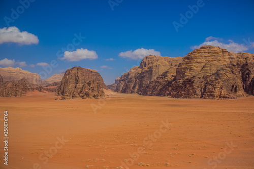 picturesque vivid yellow and orange colorful sunny Utah desert scenery landscape with mountain ridge background
