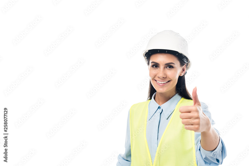 Smiling engineer in hardhat showing thumb up isolated on white Smiling engineer in hardhat showing thumb up isolated on white