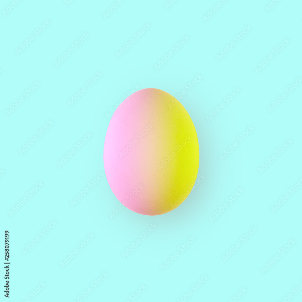 Easter egg in duotone colors on turquoise background. Minimal styled concept. Easter egg in duotone colors on turquoise background. Minimal styled concept.