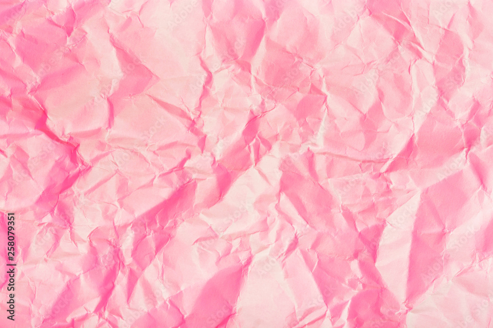 Texture of crumpled paper. Trendy pink background.