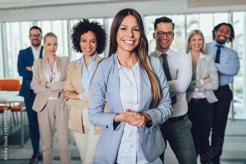 Group of happy business people and company staff in modern office, representig company.Selective focus.