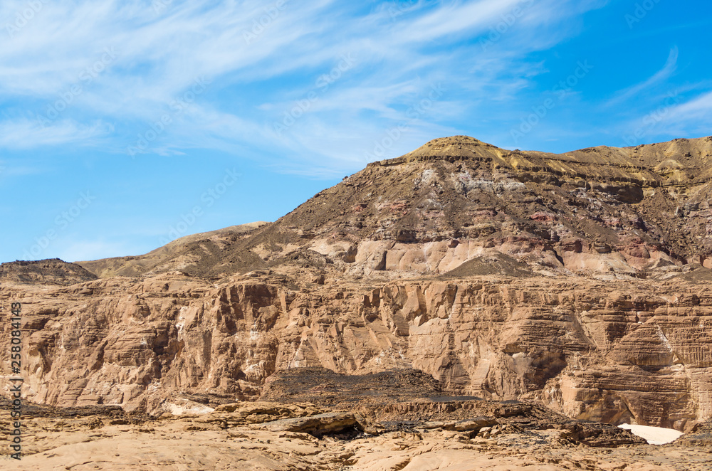 Obraz premium high rocky mountains in the desert against the blue sky and white clouds in Egypt Dahab South Sinai