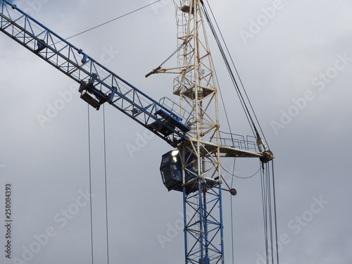 Tower cranes and their parts, construction of a new house. © Konstantin