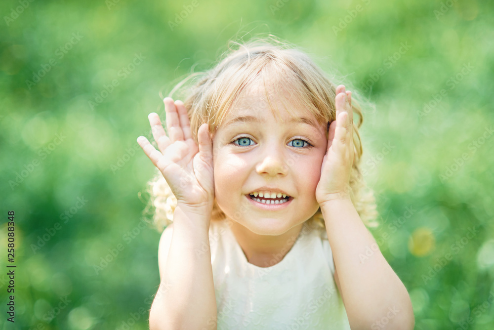 girl sniffing flowers of apple orchard. garden with flowering trees girl sniffing flowers of apple orchard. garden with flowering trees